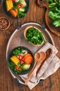 Chilean meat soup with pampkin, corn, fresh coriander and potatoes on old wooden table background. Cazuela. Latinamerican food