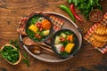 Chilean meat soup with pampkin, corn, fresh coriander and potatoes on old wooden table background. Cazuela. Latinamerican food