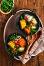 Chilean meat soup with pampkin, corn, fresh coriander and potatoes on old wooden table background. Cazuela. Latinamerican food Royalty Free Stock Photo