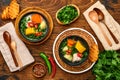 Chilean meat soup with pampkin, corn, fresh coriander and potatoes on old wooden table background. Cazuela. Latinamerican food Royalty Free Stock Photo