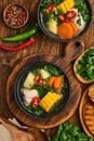 Chilean meat soup with pampkin, corn, fresh coriander and potatoes on old wooden table background. Cazuela. Latinamerican food Royalty Free Stock Photo