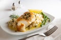 Chilean sea bass with risotto on a white plate Royalty Free Stock Photo