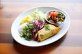 chiles rellenos plated elegantly with a side salad