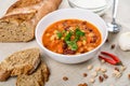 Chili Beans Stew, Bread, Red Chili Pepper And Garlic Royalty Free Stock Photo