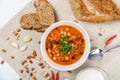 Chili Beans Stew, Bread, Red Chili Pepper And Garlic Royalty Free Stock Photo