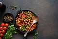 Chili con carne classic mexican dish on the kitchen table, top view