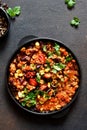 Chili con carne classic mexican dish on the kitchen table, top view