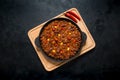 Chili con carne in frying pan on dark background. Texas chili. Royalty Free Stock Photo