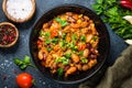 Chili con carne from meat and vegetables on black table top view Royalty Free Stock Photo