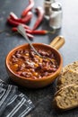 Chili con carne. Mexican food with beans in pot and bread Royalty Free Stock Photo