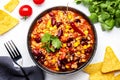 Chili con carne with minced beef, red beans, paprika, sweet corn and hot peppers in spicy tomato sauce, tex-mex cuisine dish, Royalty Free Stock Photo