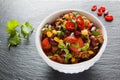 Chili con carne in a white ceramic bowl on black stone background. Royalty Free Stock Photo