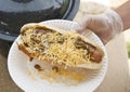 Chili dog on paper plate