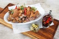 Chili Garlic Pork Knuckle Cripy Pata with spicy salad served in a dish isolated on grey background side view