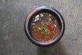 Chili paste that is commonly eaten in Thailand is a mixture of chilli, shrimp paste, garlic, fish sauce, sugar, put in mortars.