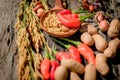 Peanut Purple flowers Red chili Golden rice Wood background