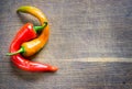 Chili pepers on wooden board.Background.