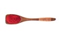 Spice chili pepper powder in wooden spoon isolated on a white b Royalty Free Stock Photo