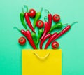 Chili pepper and shopping bag ant tomatoes Royalty Free Stock Photo