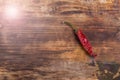 Chili pepper on wooden table