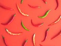 Chili peppers on a red background