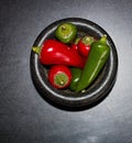 Chili Peppers In Stone Mortar & Pestle Up Close Above View Royalty Free Stock Photo