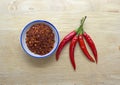 Chili powder and fresh peppers Royalty Free Stock Photo