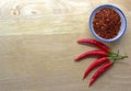 Chili powder and fresh peppers Royalty Free Stock Photo