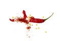 Chili, red pepper flakes and chili powder burst. Royalty Free Stock Photo