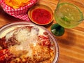 Chili rellenos and margarita wood top table Royalty Free Stock Photo