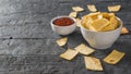 Chili sauce. Chips from a Mexican tortilla. The rustic table. Royalty Free Stock Photo