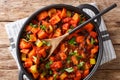 Chili sweet potatoes and black beans with tomatoes, celery close-up in a pan. Horizontal top view Royalty Free Stock Photo