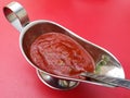 Chili tomato sauce on a red Royalty Free Stock Photo