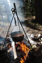 Chili warming over a campfire