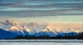 Chilkat River and Mountains in snow on a sunrise. Royalty Free Stock Photo