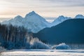 Chilkat River and Mountains in snow on a sunrise. Royalty Free Stock Photo