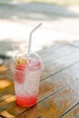 Chill out with strawberry soda cocktail on wood table at the Cafe for fresh summer or relax time after hard working.