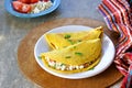 Chilla, tortillas or pancakes made from chickpea flour stuffed with cheese panir and tomato on a white plate Royalty Free Stock Photo