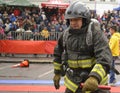Professional firefighter in uniform and helmet.