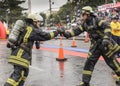 Professional firefighters completing the circuit during the competition.