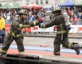 Professional firefighters completing the circuit during the competition.