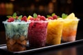 Chilled delight, row of icy fruit slushies, each in a plastic cup Royalty Free Stock Photo