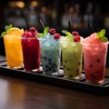 Chilled delight, row of icy fruit slushies, each in a plastic cup Royalty Free Stock Photo