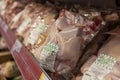 Chilled raw chickens in packaging on store shelves. Side view. Close-up. Moscow, Russia, 11-25-2020