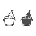 Chilled wine in bucket line and solid icon. Alcohol drink bottle in ice cooler outline style pictogram on white Royalty Free Stock Photo