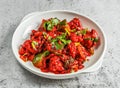 chilli chicken served in dish isolated on background top view of desi indian food