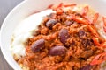 Chilli con carne with rice in a white bowl. Royalty Free Stock Photo