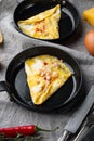 Chilli crab silky omlette , on frying iron pan, on gray background Royalty Free Stock Photo