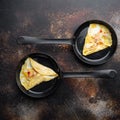 Chilli crab silky omlette , on frying iron pan, on old dark rustic background, top view flat lay Royalty Free Stock Photo