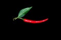Chilli pepper with leaf red vegetable isolated on black Royalty Free Stock Photo